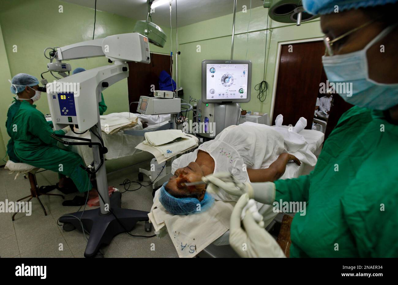 In this Nov. 4, 2011 photo, an assistant prepares a cataract patient
