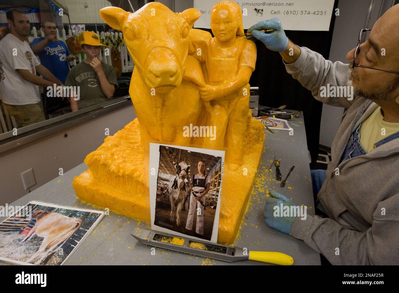 Man creates a sculpture out of cheese at the Nebraska State Fair, USA; Lincoln, Nebraska, United States of America Stock Photo