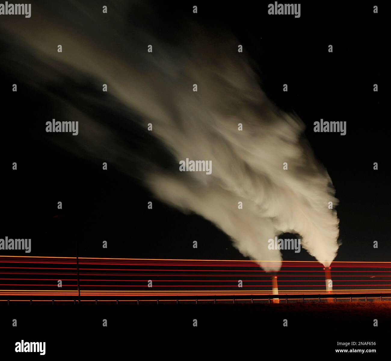 A truck is blurred during a time exposure as it passes by the La Cygne