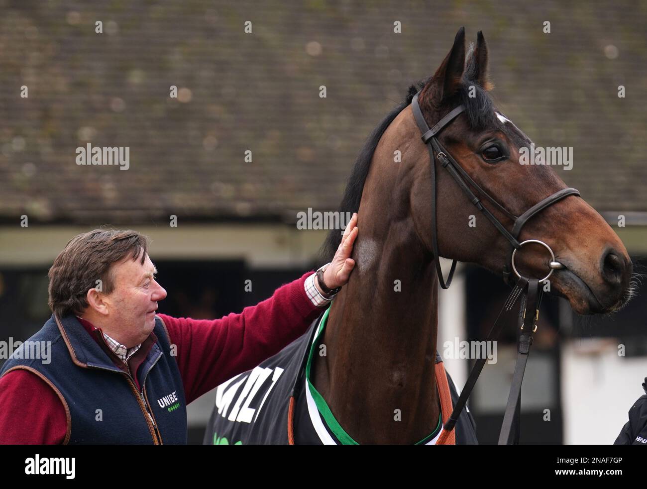 Trainer Nicky Henderson and Marie's Rock during a visit to Nicky