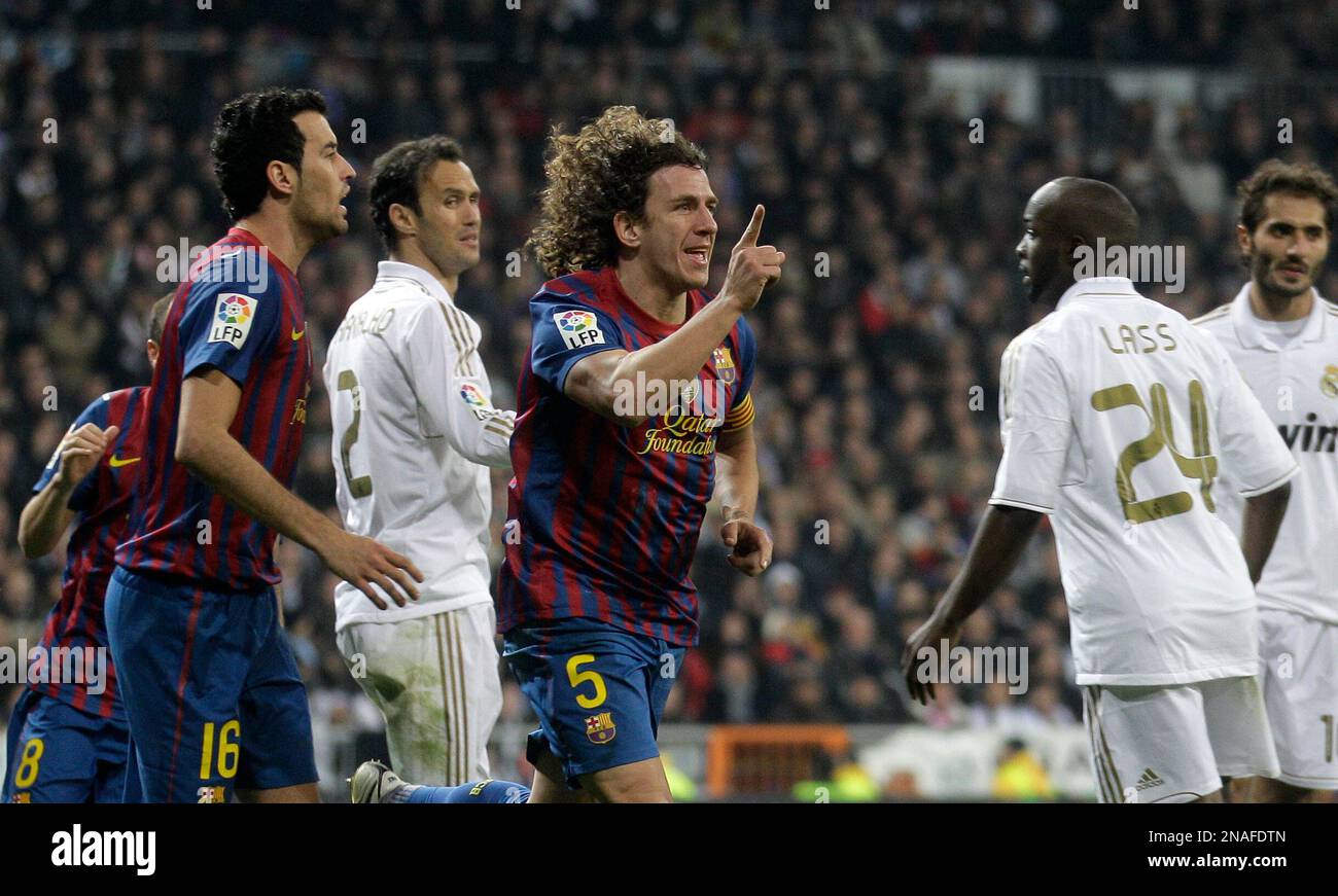 FC Barcelona's Carles Puyol, centre celebrates after scoring against
