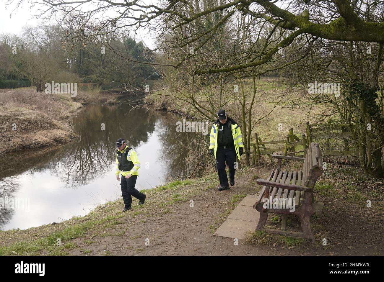 Police activity near the bench by the River Wyre in St Michael's on Wyre, Lancashire, where the mobile phone was found as police continue their search for missing woman Nicola Bulley, 45, who vanished on January 27 while walking her springer spaniel Willow shortly after dropping her daughters, aged six and nine, at school. Picture date: Monday February 13, 2023. Stock Photo