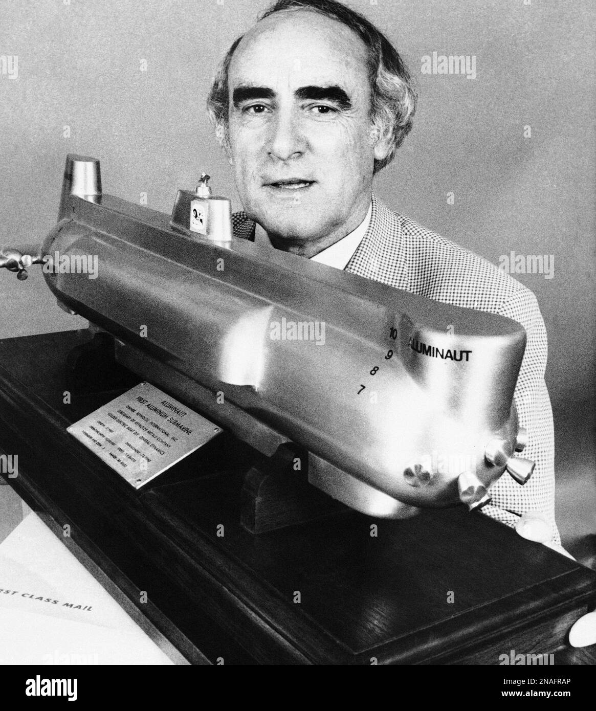 Jack Grimm, Texas oilman and consummate wildcatter, looks at a model Aluminaut, in New York on August 22, 1980. The Aluminaut is the submarine which will be used in Grimm's search for the Titanic. (AP Photo/Dave Pickoff) Stock Photo