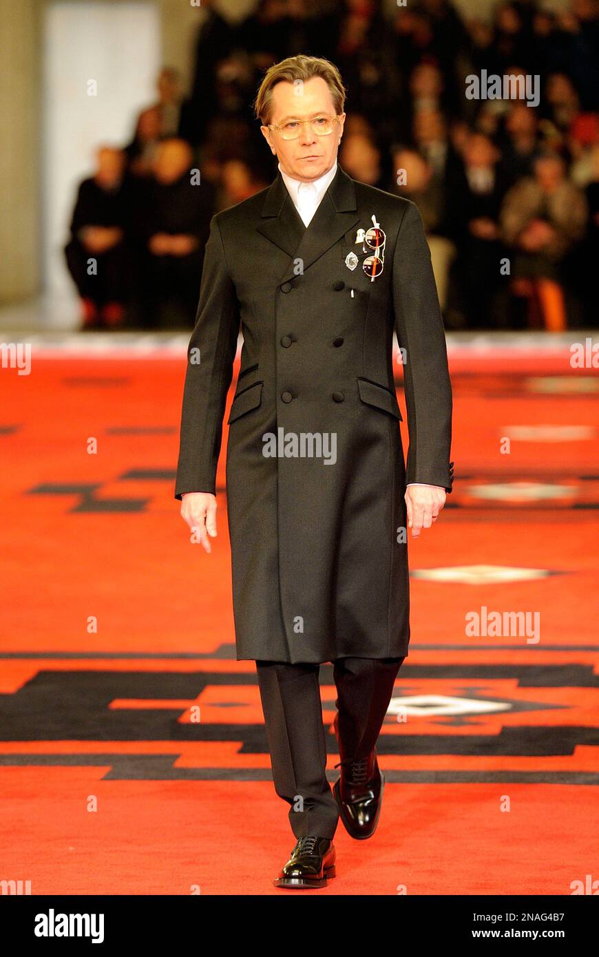 British actor Gary Oldman wears a creation of Prada men's Fall-Winter  2012-13 collection part of the Milan Fashion Week unveiled in Milan, Italy,  Sunday, Jan 15, 2012. (AP Photo/Giuseppe Aresu Stock Photo -
