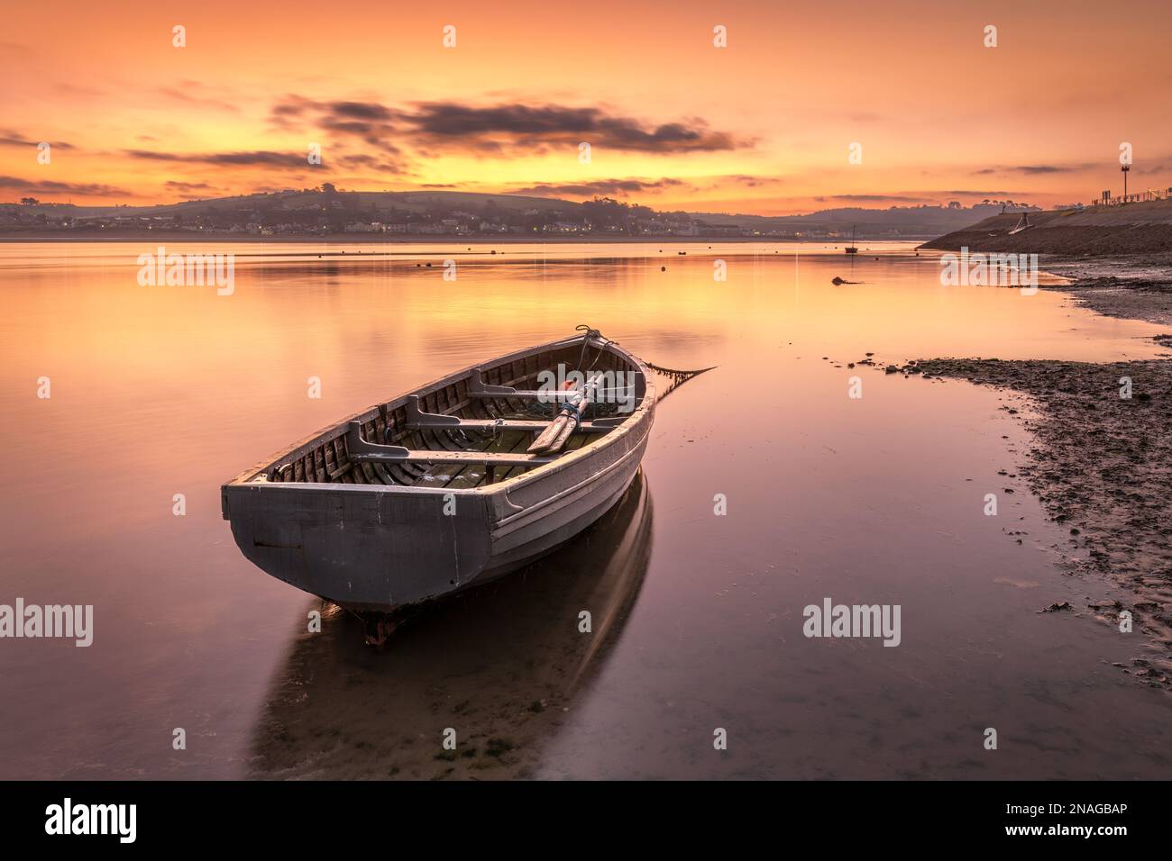 Appledore, Devon, UK. 13th Feb, 2023. The North Devon coastal villages of Instow and Appledore wake up to a colourful dawn sky as the incoming tide on the the River Torridge quickly covers the shoreline on a very tranquil February morning. Credit: Terry Mathews/Alamy Live News Credit: Terry Mathews/Alamy Live News Stock Photo