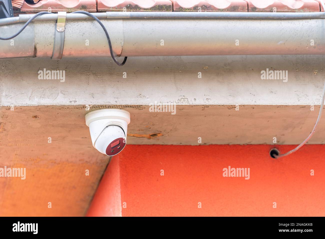 security camera on the facade of the house Stock Photo Alamy