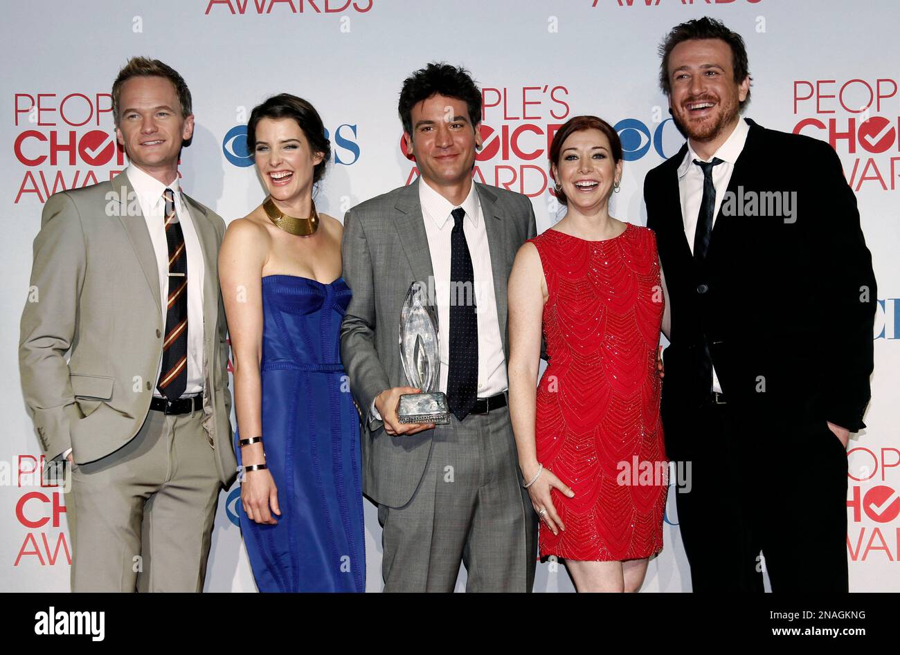 From left, Neil Patrick Harris, Cobie Smulders, Josh Radner, Alyson  Hannigan, and Jason Segel pose backstage with the award for favorite  network TV comedy for "How I Met Your Mother" at the