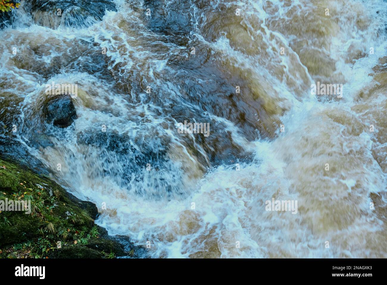 Torrent of water on fast flowing river in Scotland. Stock Photo