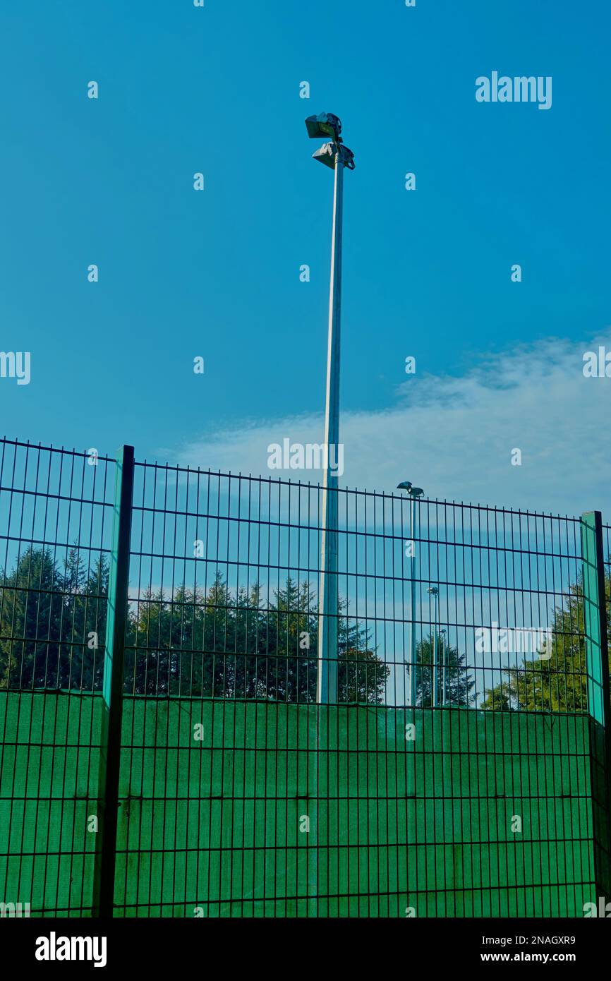 Floodlights and fencing at a football pitch, Stock Photo