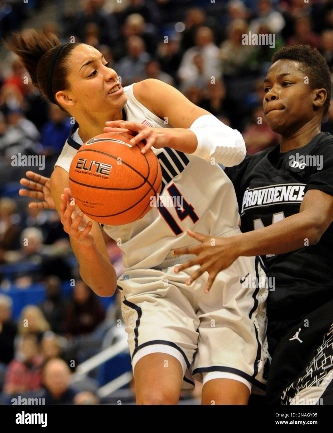 Providence's Symone Roberts, right, tries to get the ball away from Connecticut's Bria Hartley