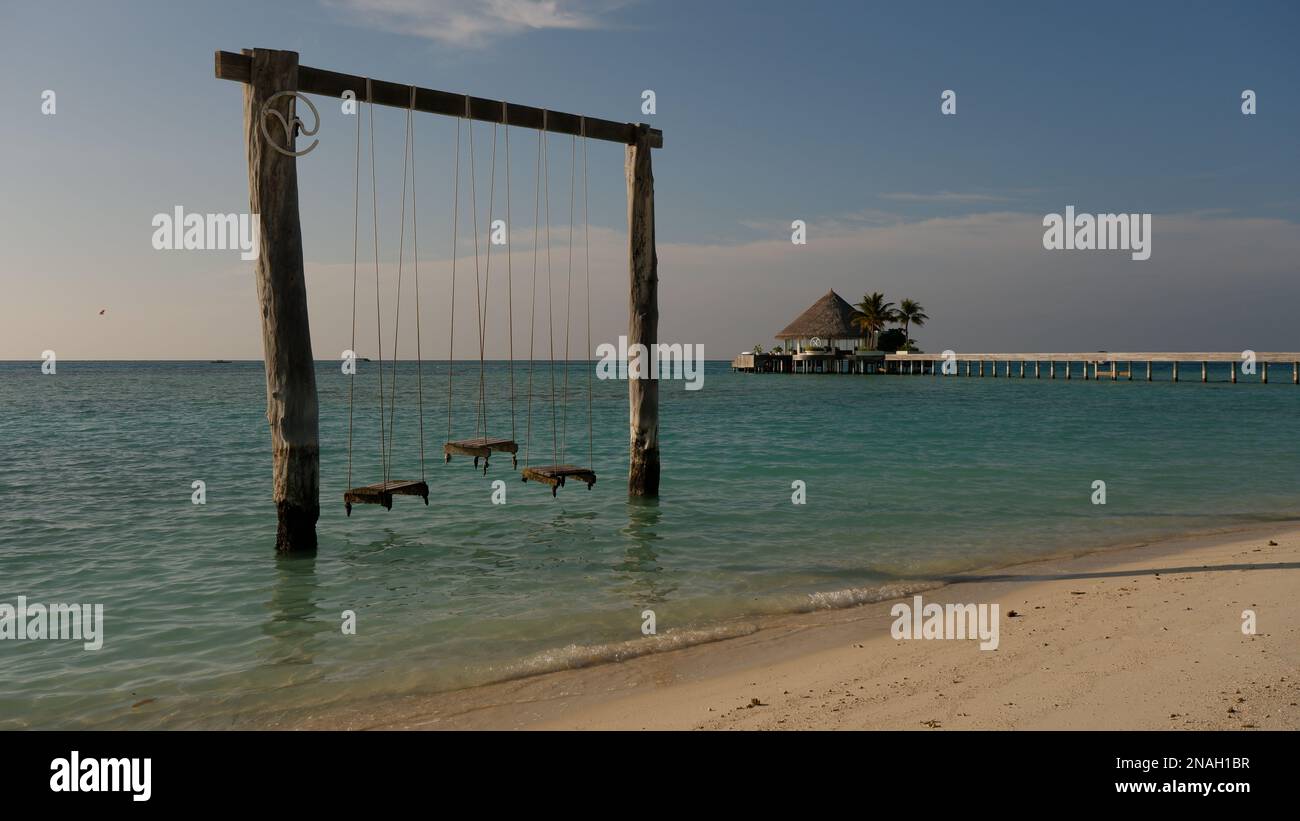 Swings by the ocean Stock Photo Alamy