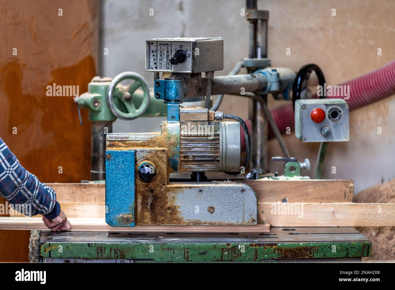 planing boards on a machine in a joinery. production of solid wood