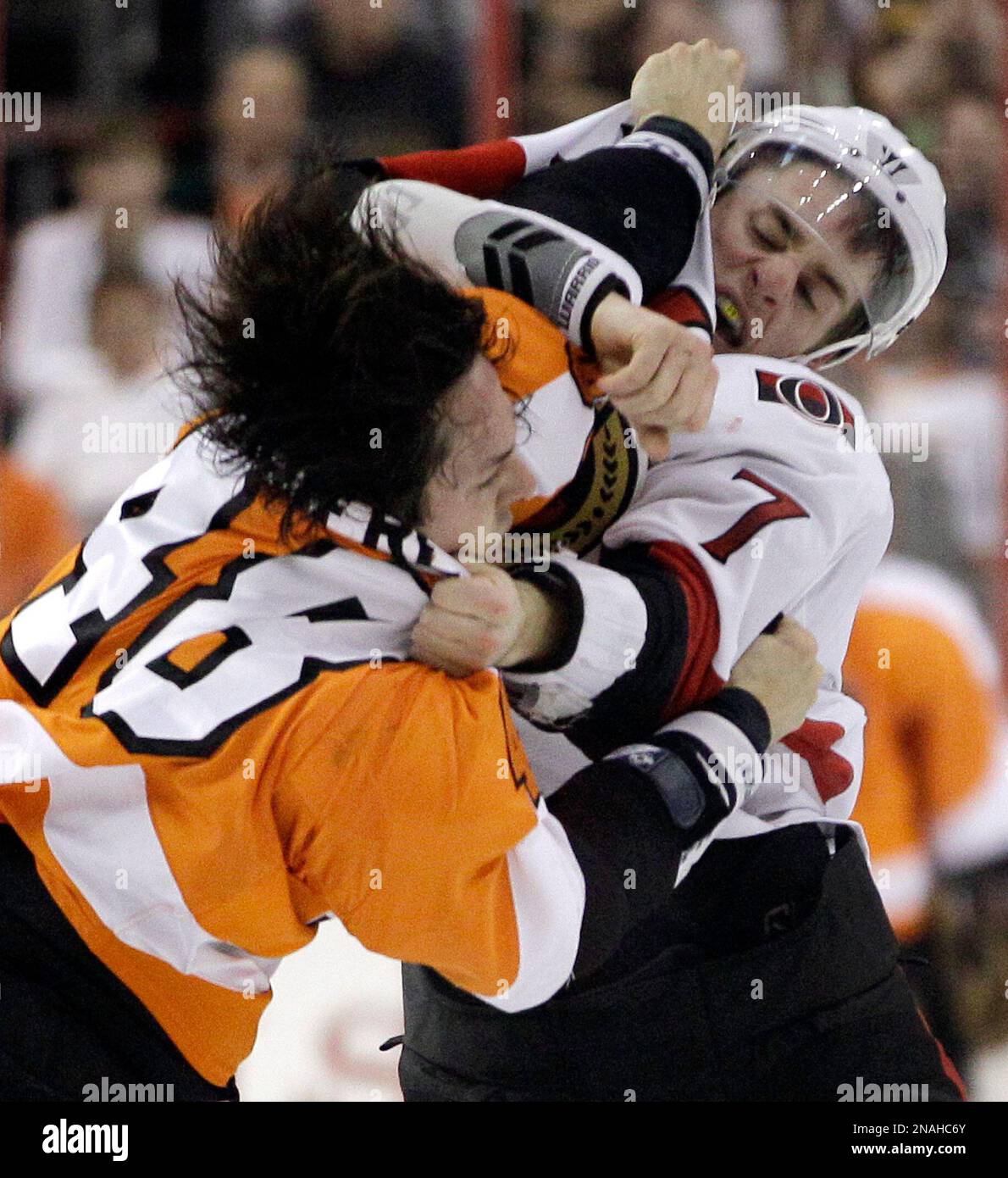 The Philadelphia Flyers' Danny Briere, left, and the New Jersey Devils'  David Clarkson vie for the puck during the first period at the Wells Fargo  Center in Philadelphia, Pennsylvania, on Thursday, April