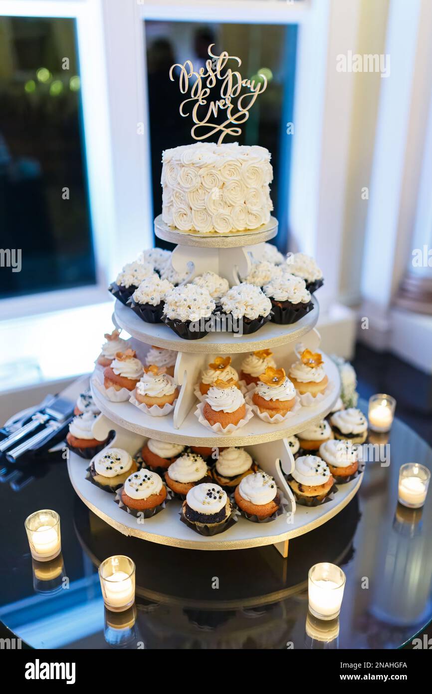 Cupcake 3 4 tier wedding cake with candles Stock Photo
