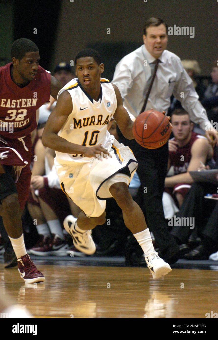 Eastern Kentukcy head coach Jeff Neubauer calls to his player D'Mitri Riggs  (32) to make an adjustment as he pressures Murray State's Zay Jackson (10)  in the second half of an NCAA