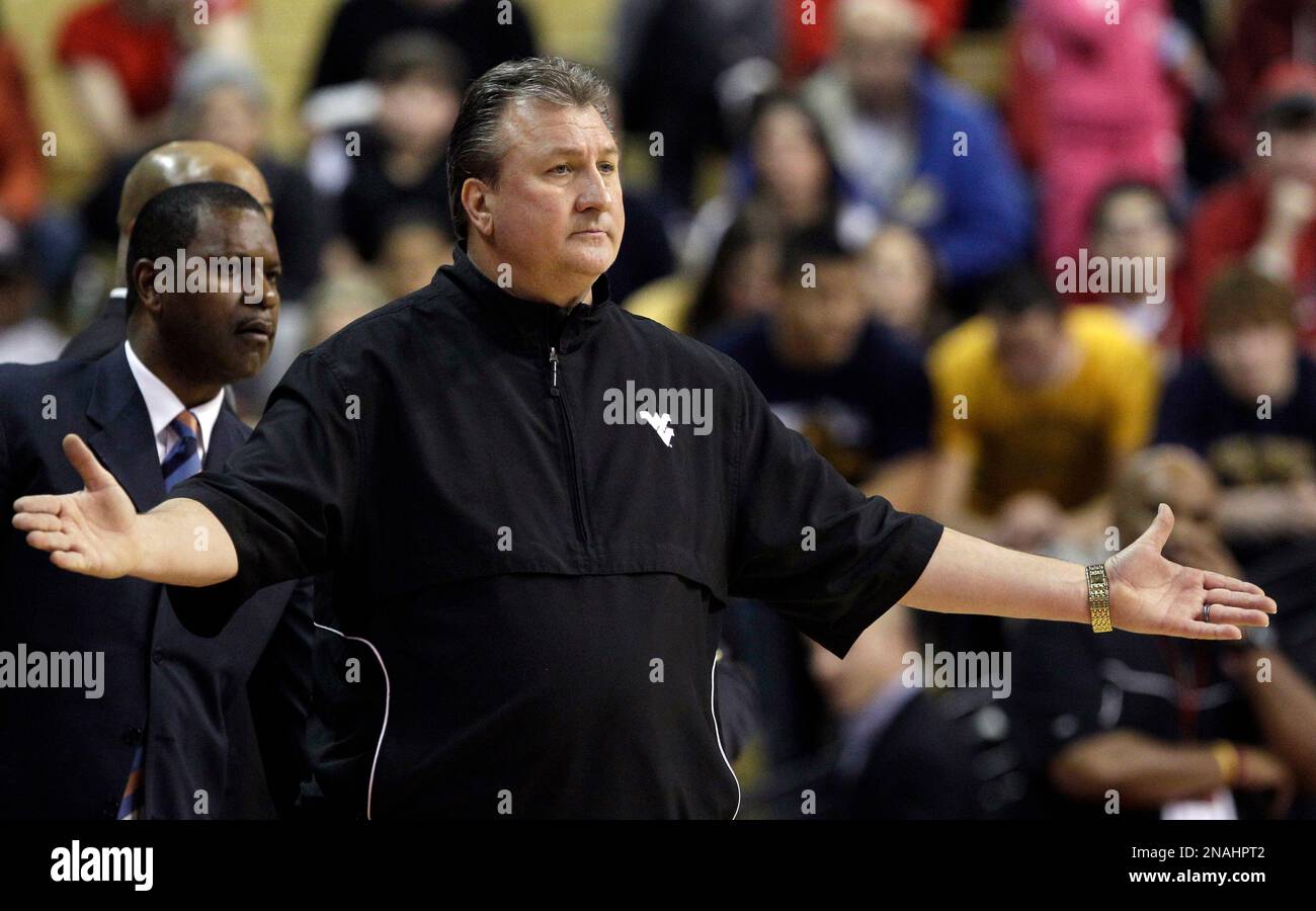 West Virginia head coach Bob Huggins reacts to play during the first half of an NCAA college