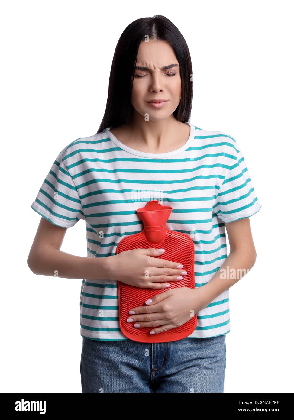 Woman using hot water bottle to relieve abdominal pain on white