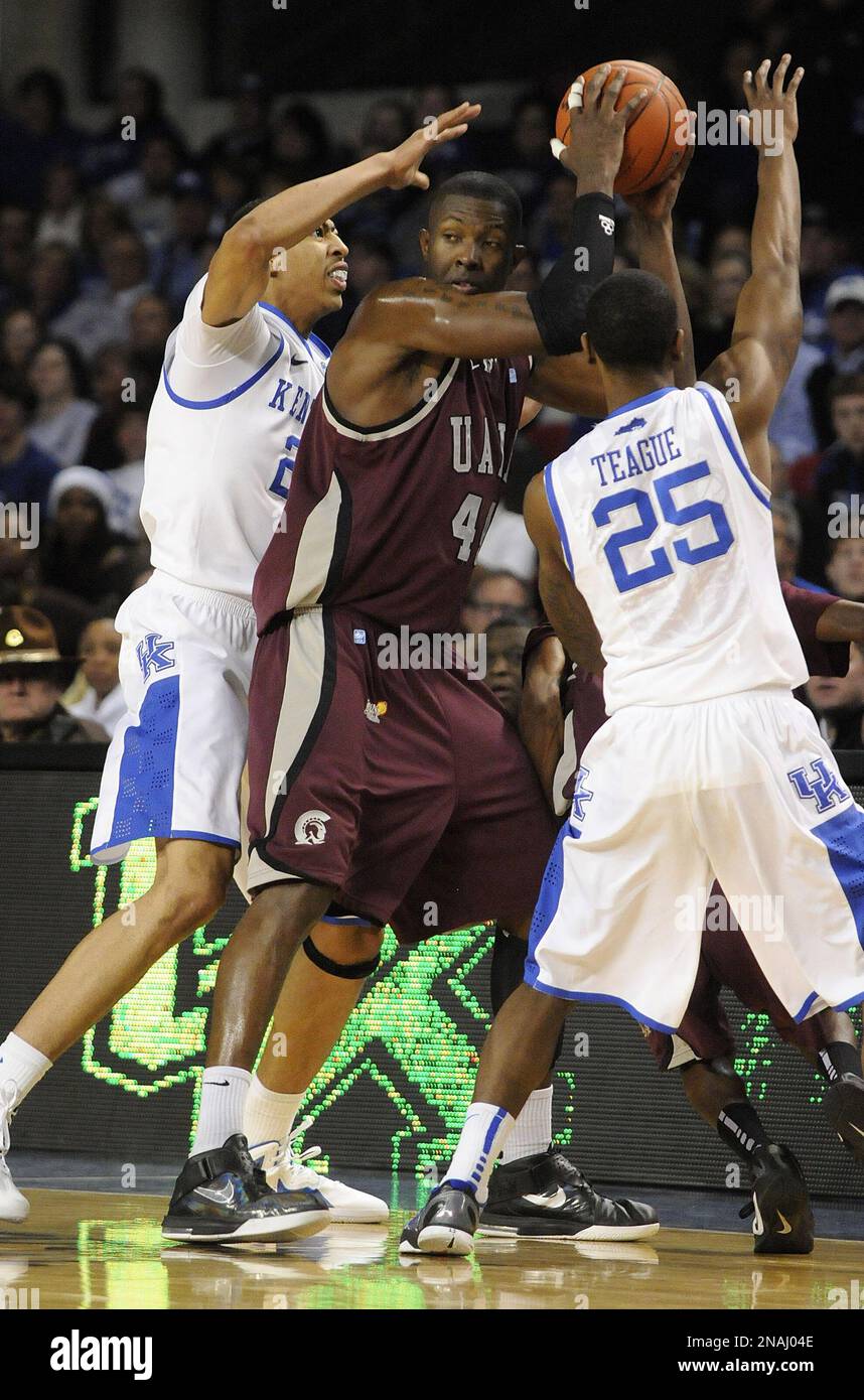 ArkansasLittle Rock's Michael Javes, center is trapped by the defense of Kentucky's Anthony