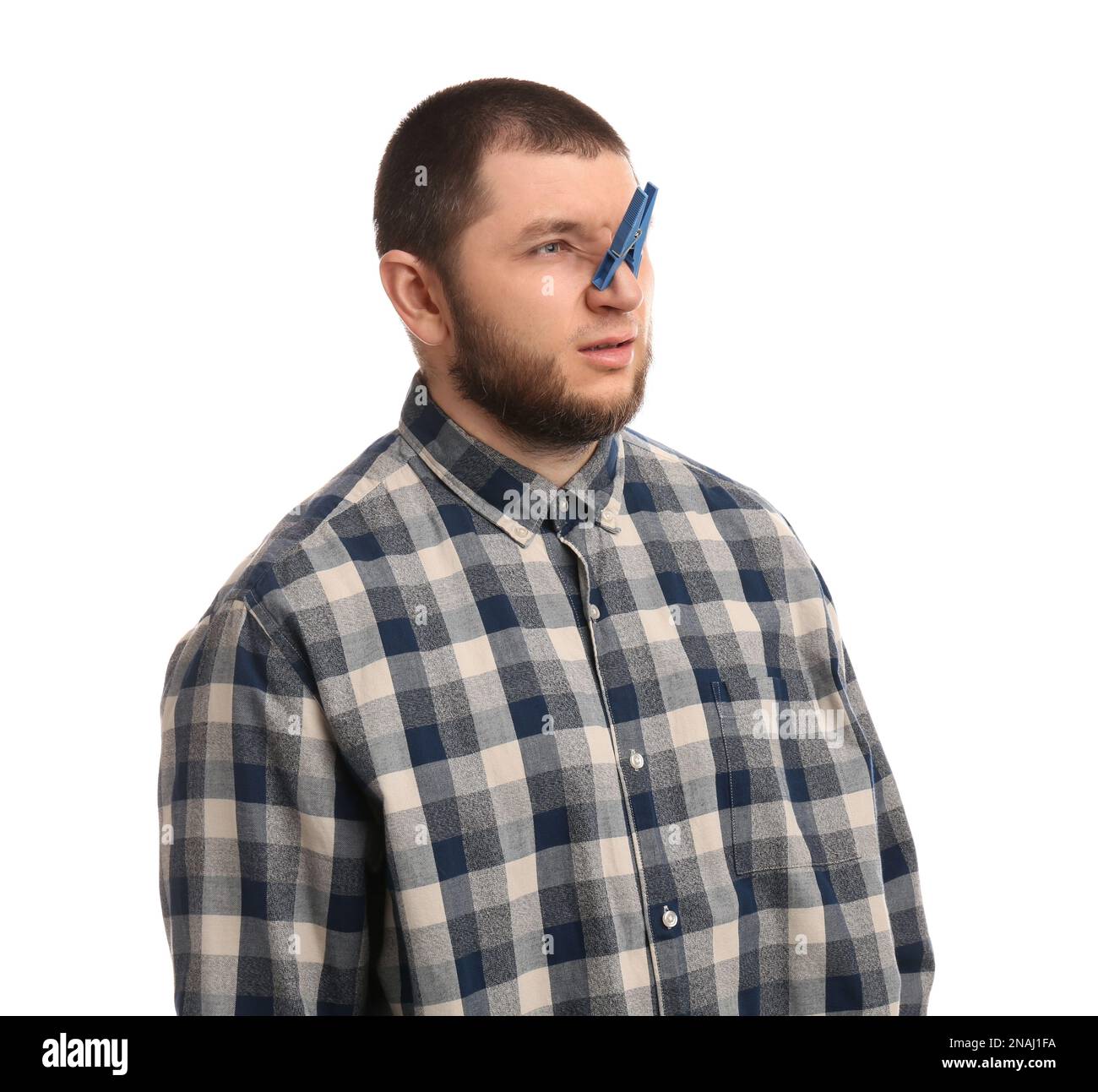 Man with clothespin on white background. Runny nose concept Stock Photo