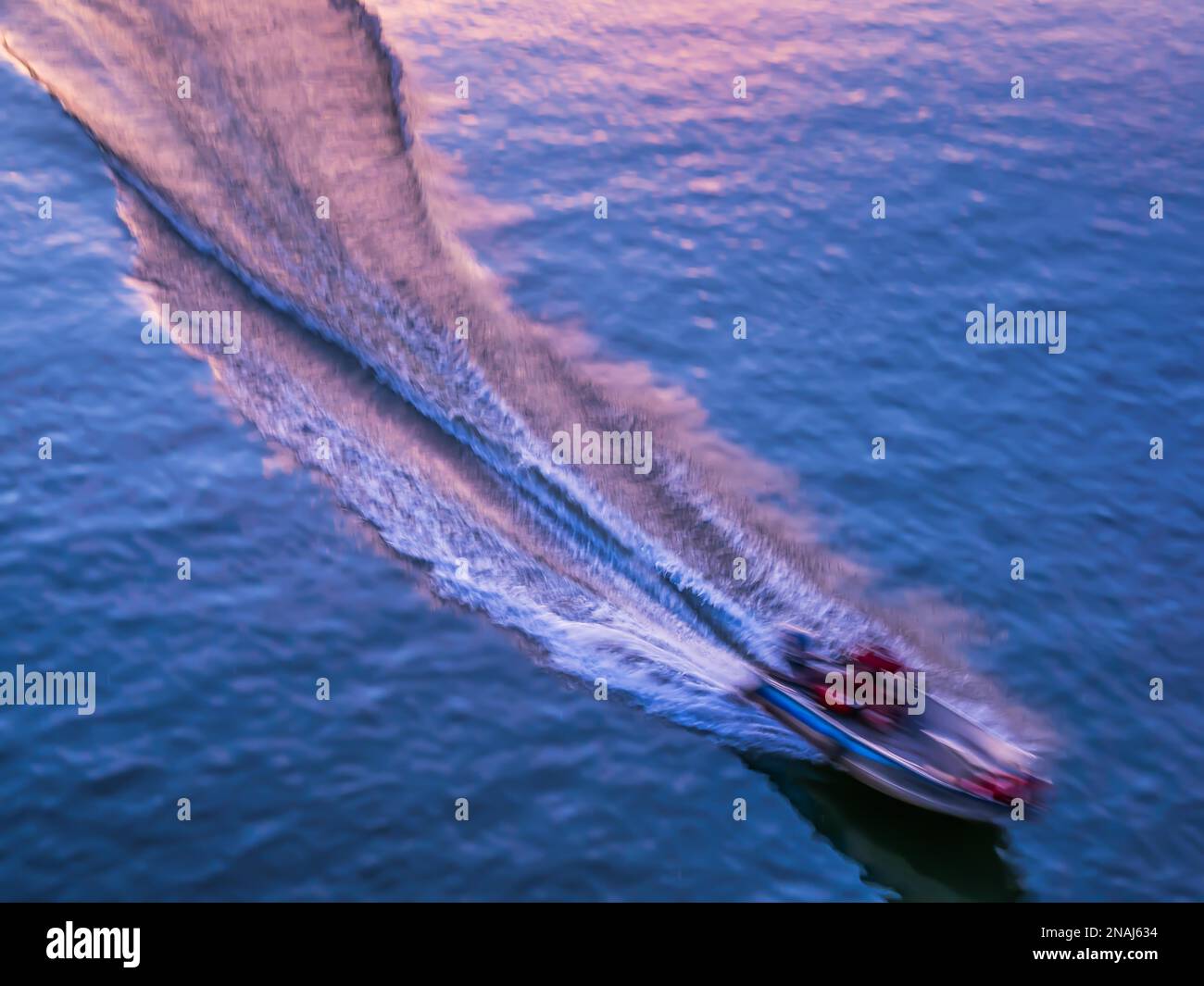Motorboat makes wave on the water surface Symbol for speed and start up ...