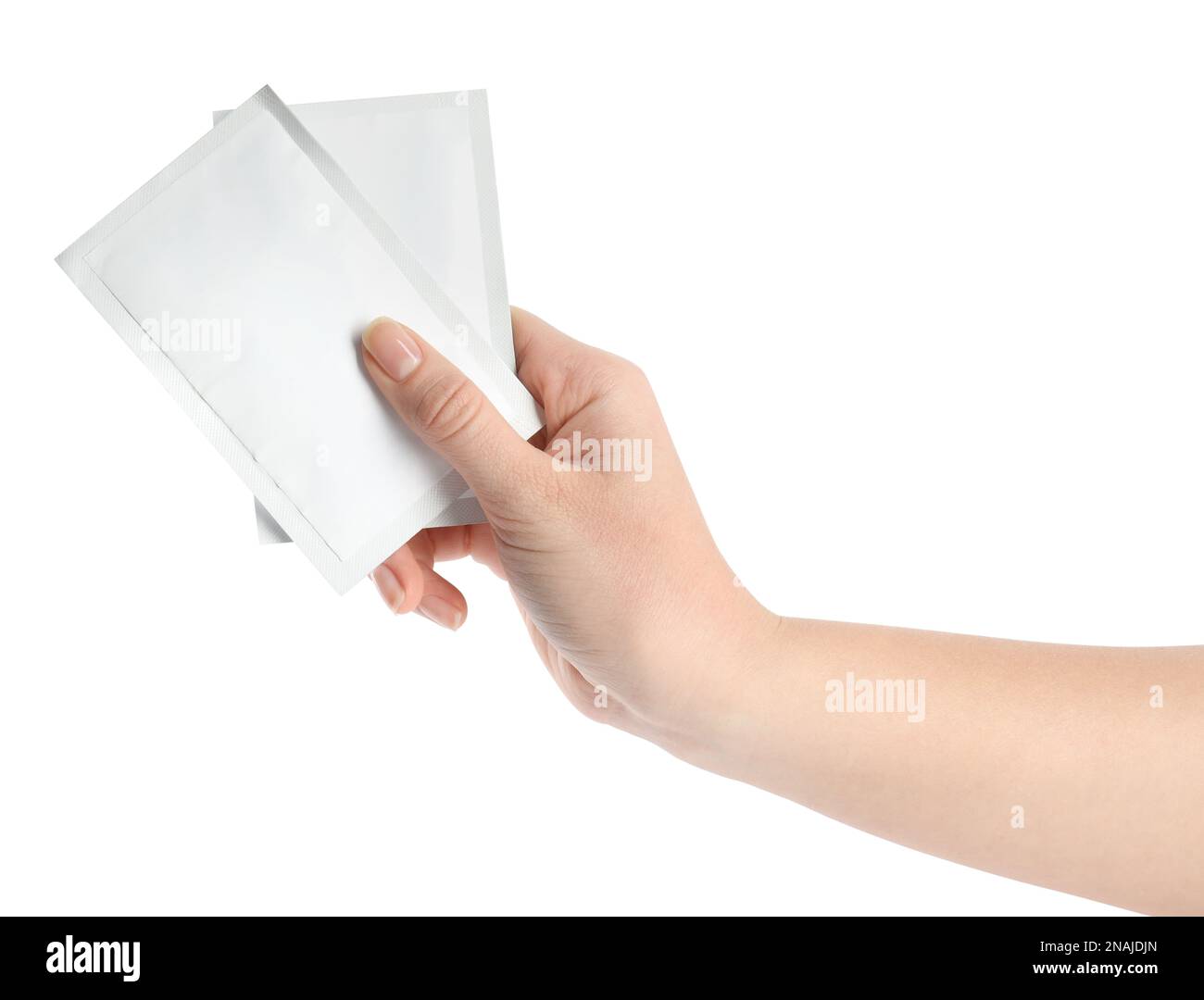Woman holding medicine sachets on white background, closeup Stock Photo
