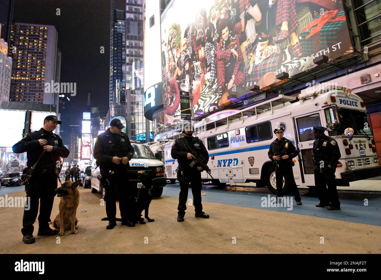 Heavily armed police officers stand guard during the New Year's Eve ...