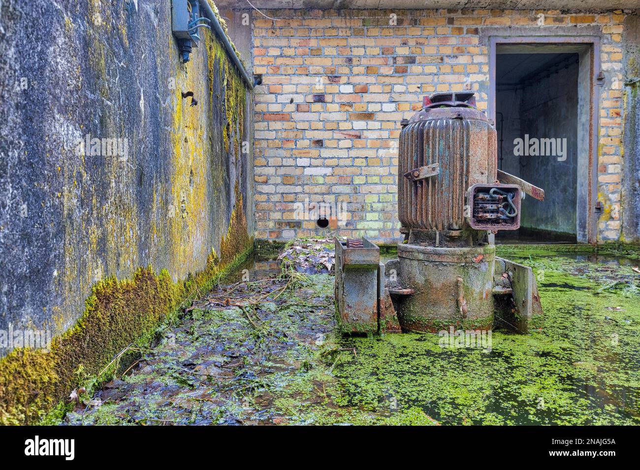 Old sewage pump large electric motor Stock Photo