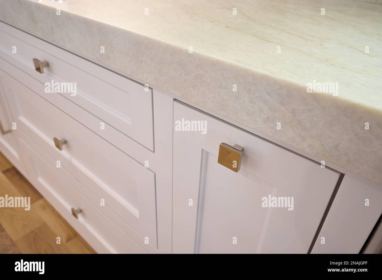 Closeup angled view of contemporary cabinet hardware and countertop Stock Photo