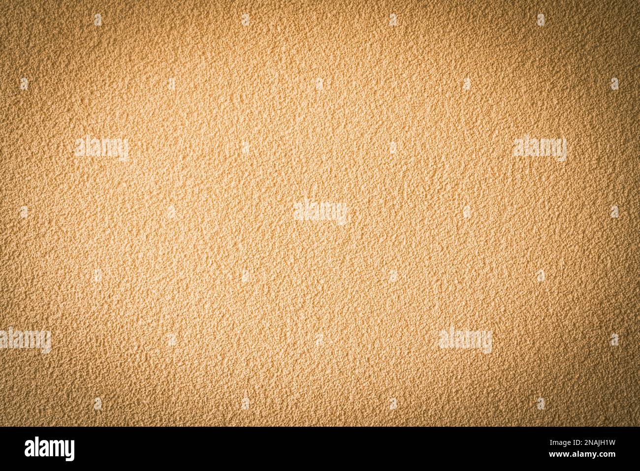 Abstract vignetting brown beige plastered wall background. Stock Photo