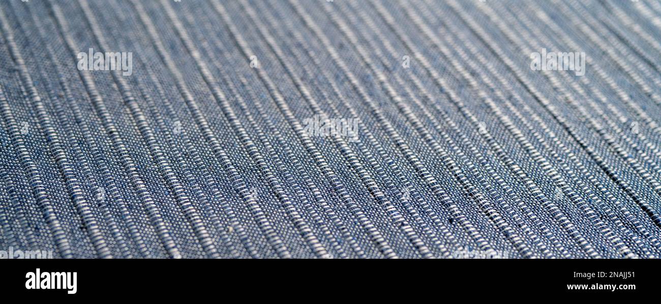 Cotton textile blue material close-up abstract defocused background. Stock Photo
