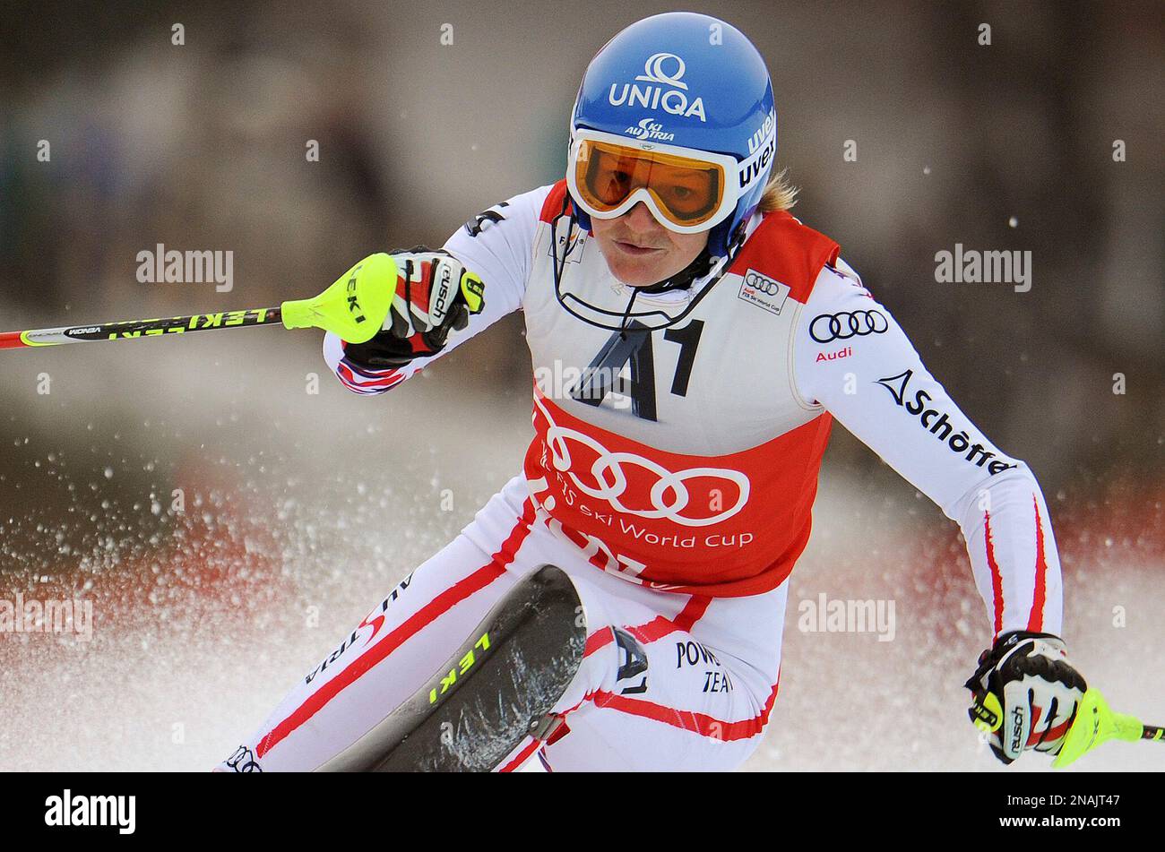 Marlies Schild, of Austria, slaloms past a pole on her way to set the fastest time during the first run of an alpine ski, womens World Cup slalom, in Lienz, Austria, Thursday,