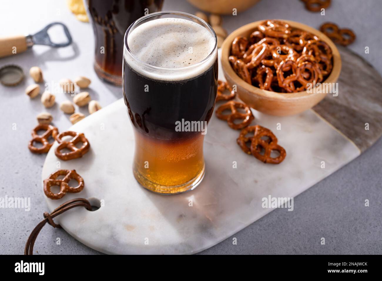 Half and half beer cocktail with lager and dark stout in a beer glass