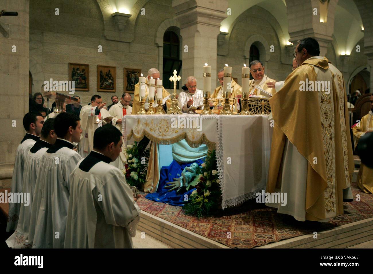 Christian priests hold the Christmas midnight Mass at the Church of the
