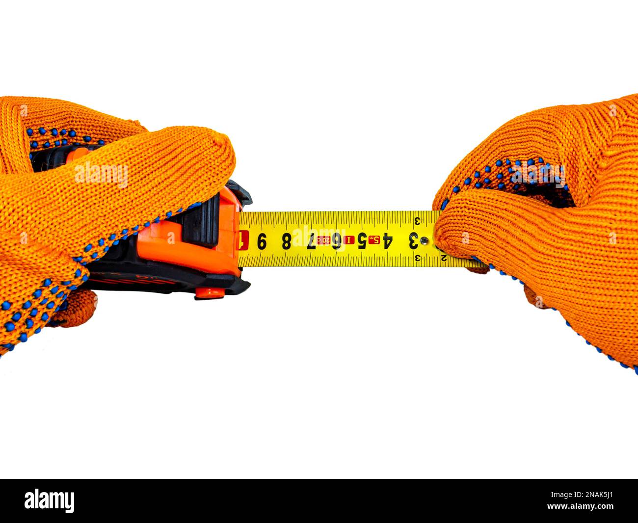 Measuring tape in the hands of a worker. Roulette measuring tool. Ruler for measurements. Work orange protective gloves. Centimeter on a white Stock Photo