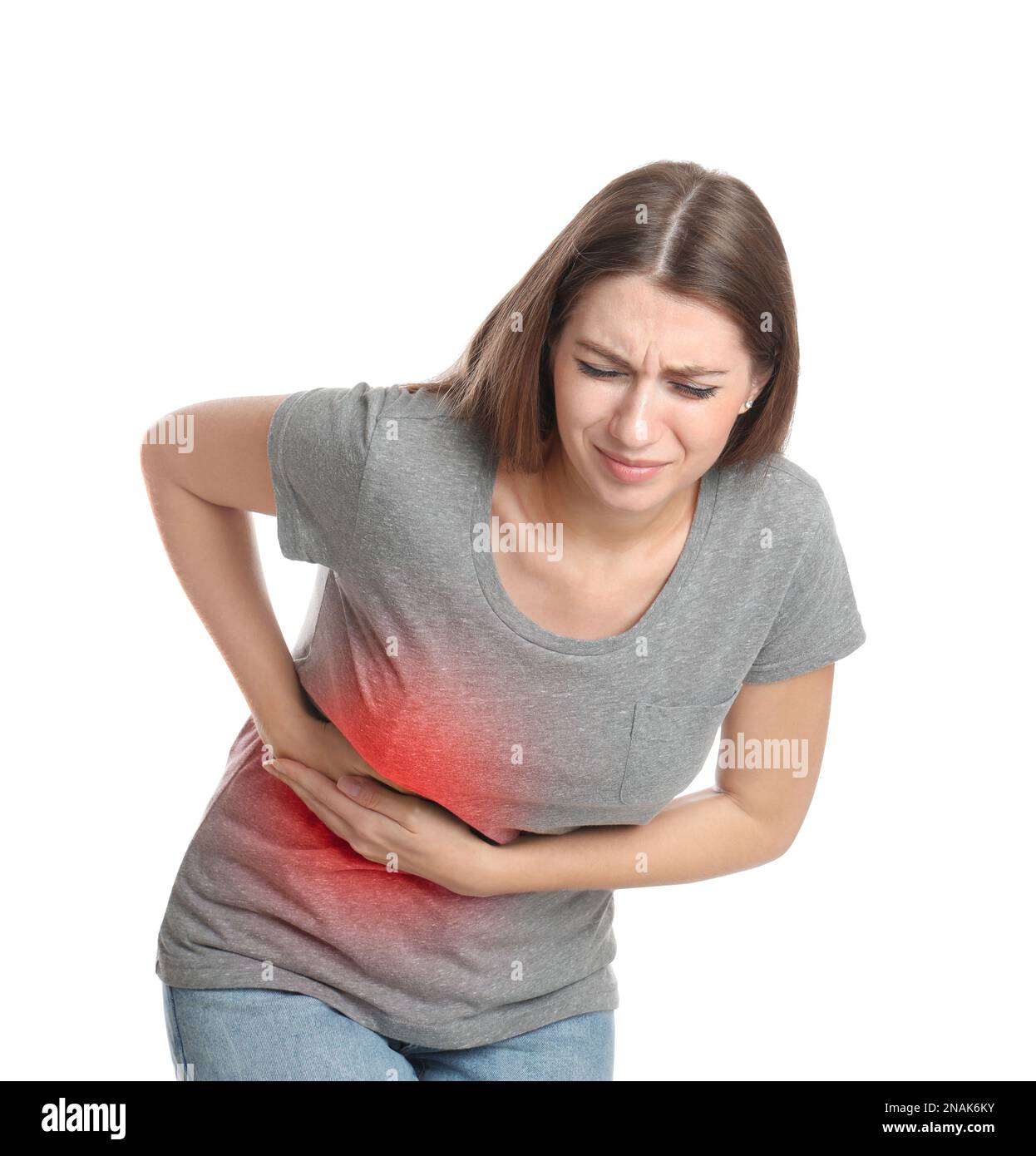 Young woman suffering from flank pain on white background Stock Photo