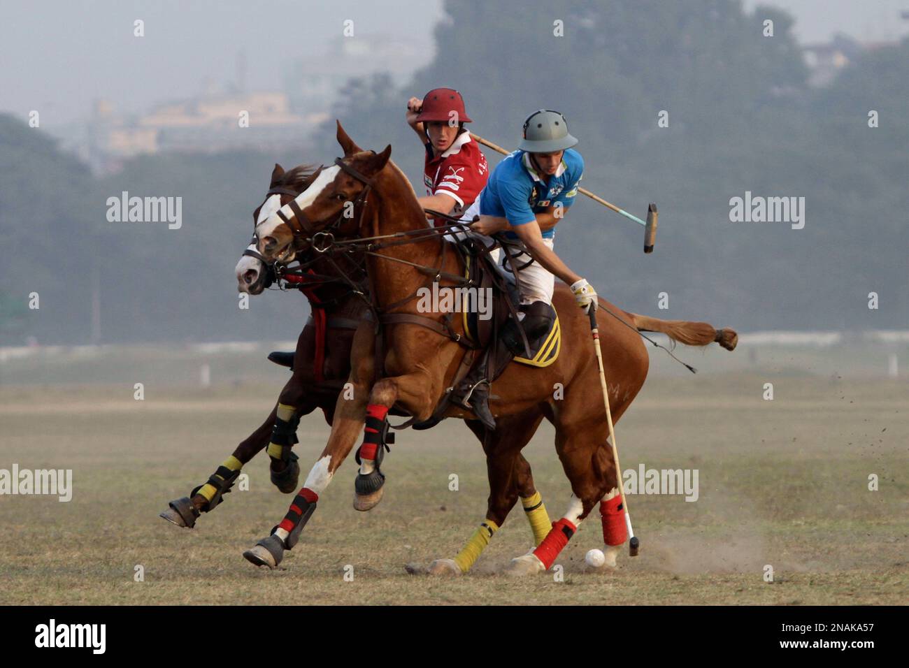 Players of Calcutta Polo Club of Kolkata, in red, and Italy's Rome Club vie for the ball during the Ezra World Cup final, in Kolkata, India, Friday, Dec. 23, 2011. The event Players of Calcutta Polo Club of Kolkata, in red, and Italy's Rome Club vie for the ball during the Ezra World Cup final, in Kolkata, India, Friday, Dec. 23, 2011. The event