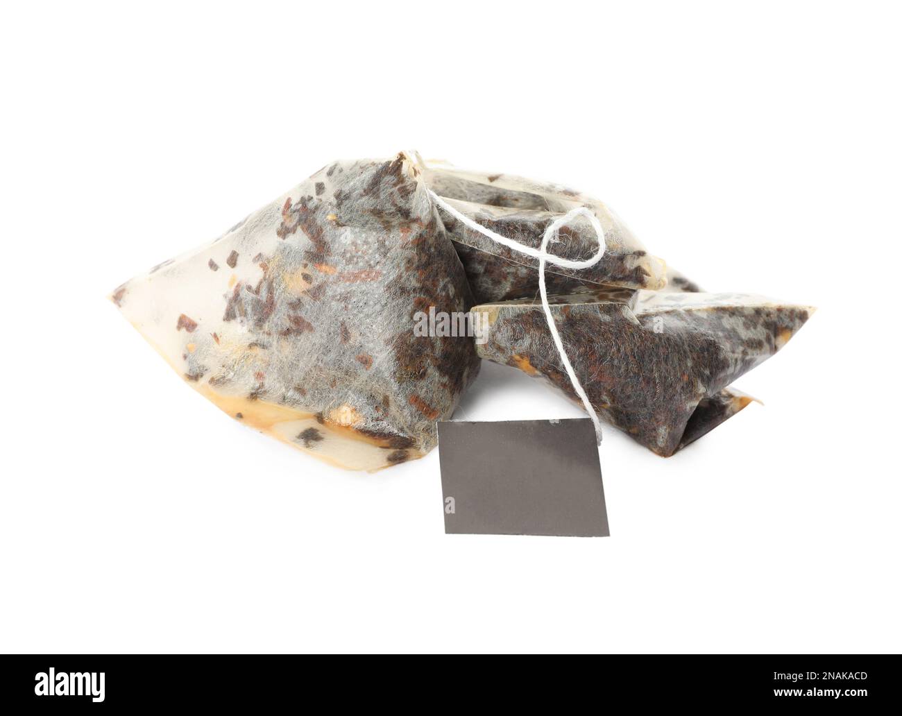 Used pyramid tea bags on white background Stock Photo Alamy