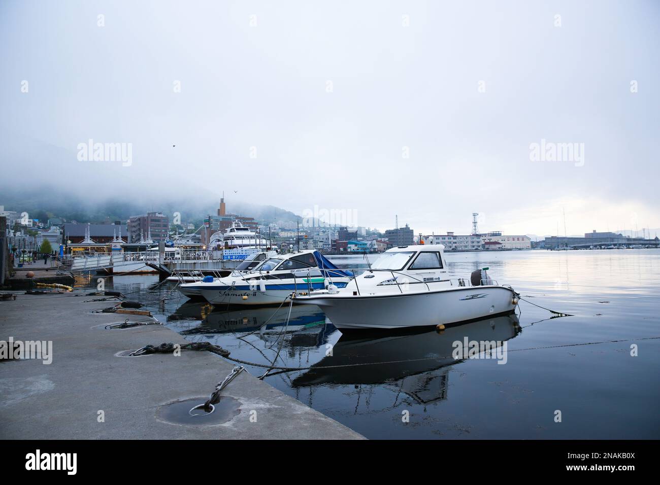 The yachts at harbor on a foggy day Stock Photo - Alamy