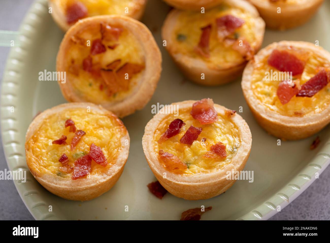 Mini quiches with bacon for Easter brunch, quiche lorraine Stock Photo