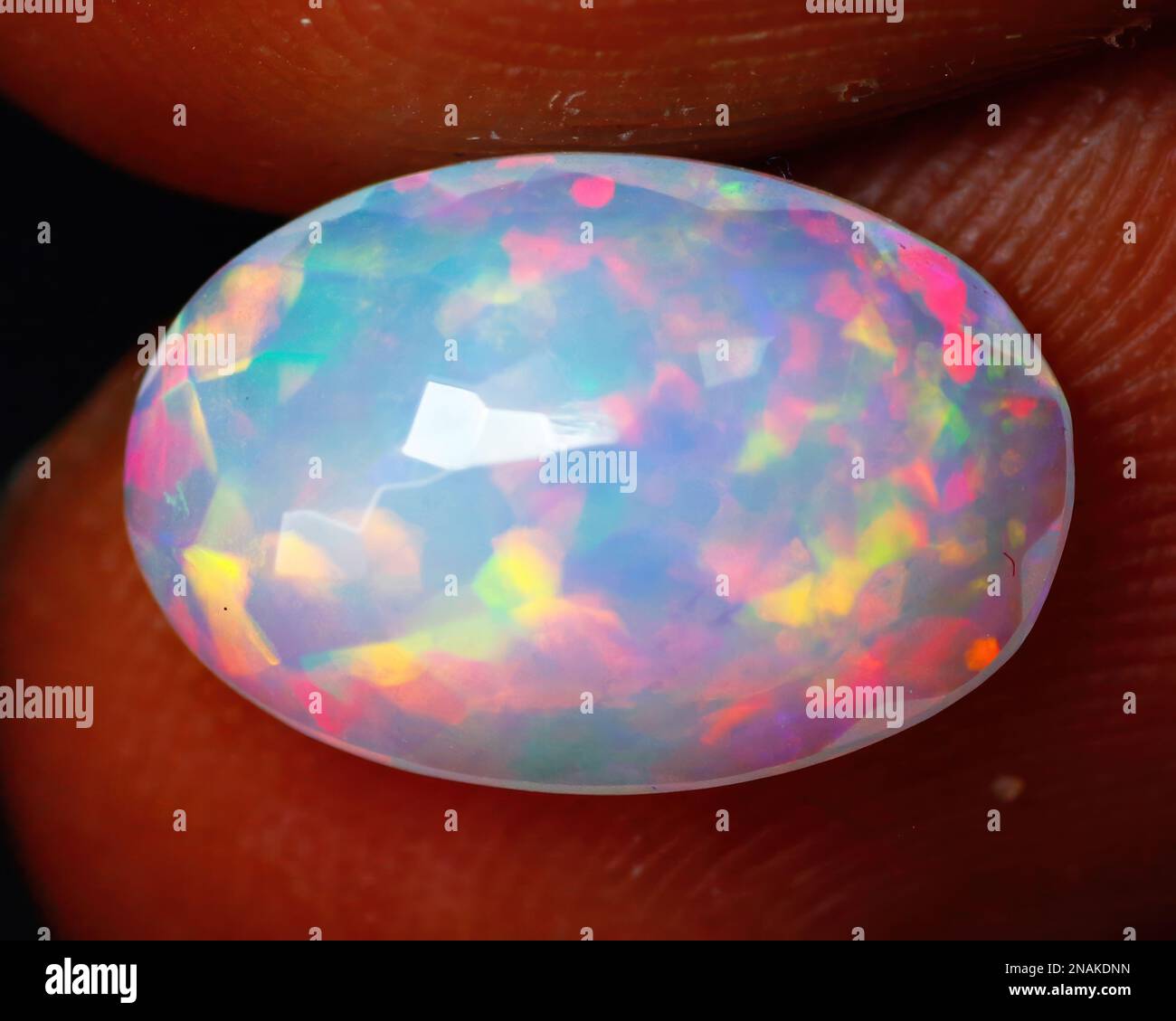 Natural gemstone noble opal on a black background Stock Photo
