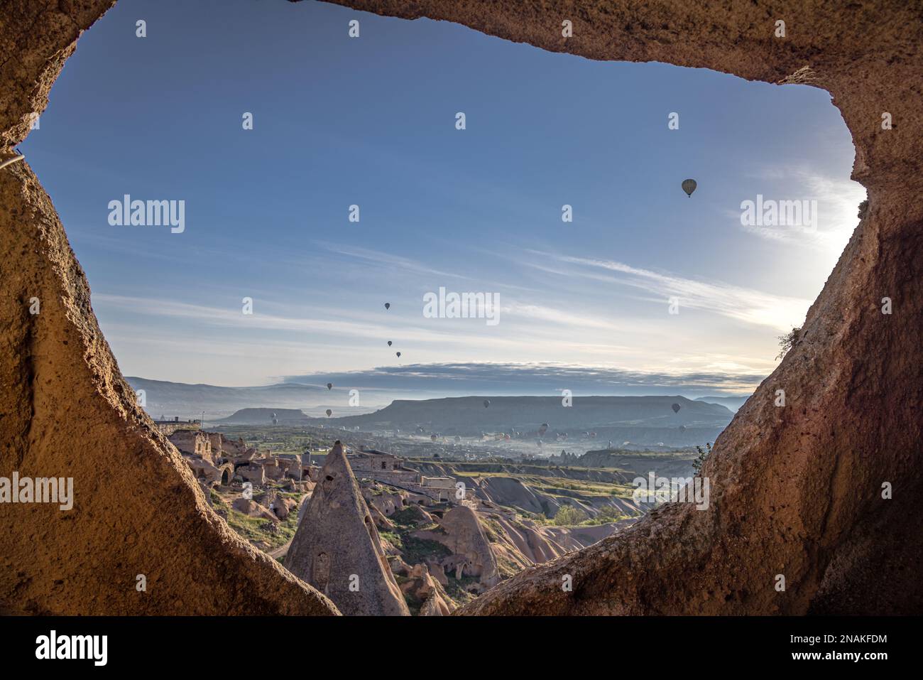 Hot Air Balloons at sunrise over the fairy chimneys at Uchisar ...