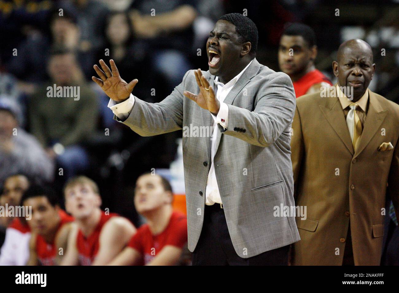 Seattle coach Cameron Dollar reacts to a play against Virginia during