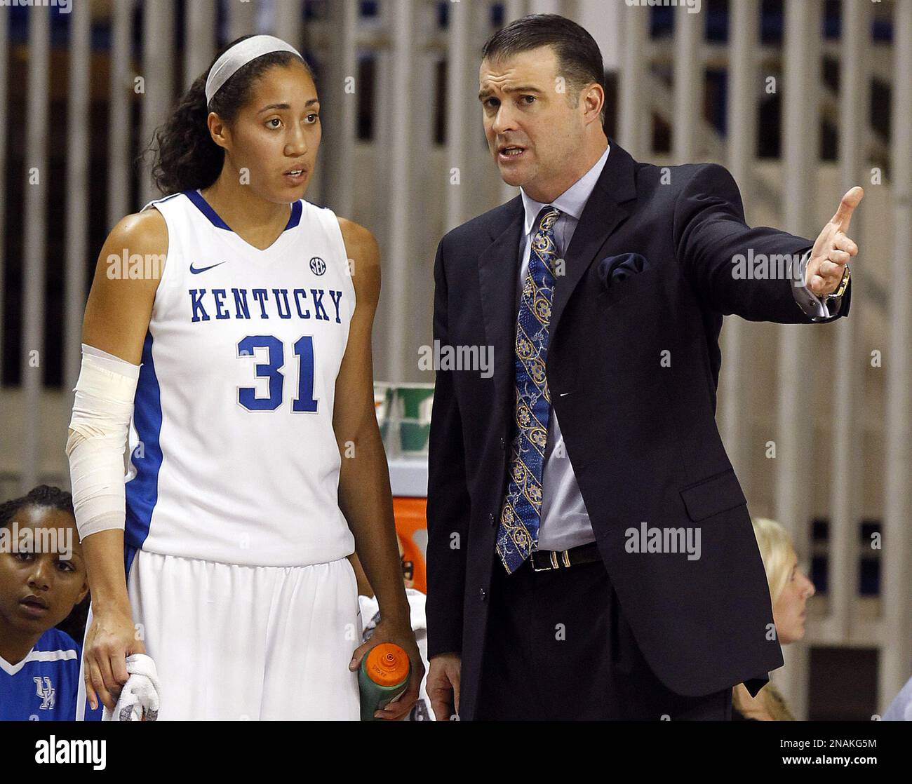 Kentucky head coach Matthew Mitchell, right, instructs Samantha Drake (31)  during the first half of an NCAA college basketball game against Samford in  Lexington, Ky., Wednesday, Dec. 21, 2011. (AP Photo/James Crisp