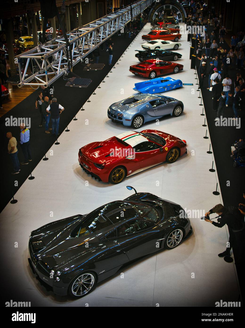 A vertical shot of a lot of supercars at the Royal Exhibition Building