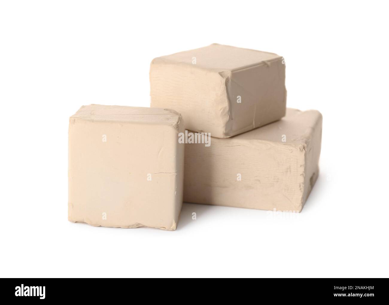 Blocks of compressed yeast on white background Stock Photo