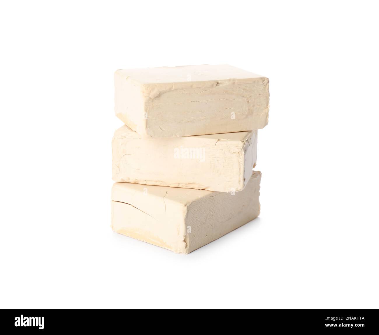 Blocks of compressed yeast on white background Stock Photo