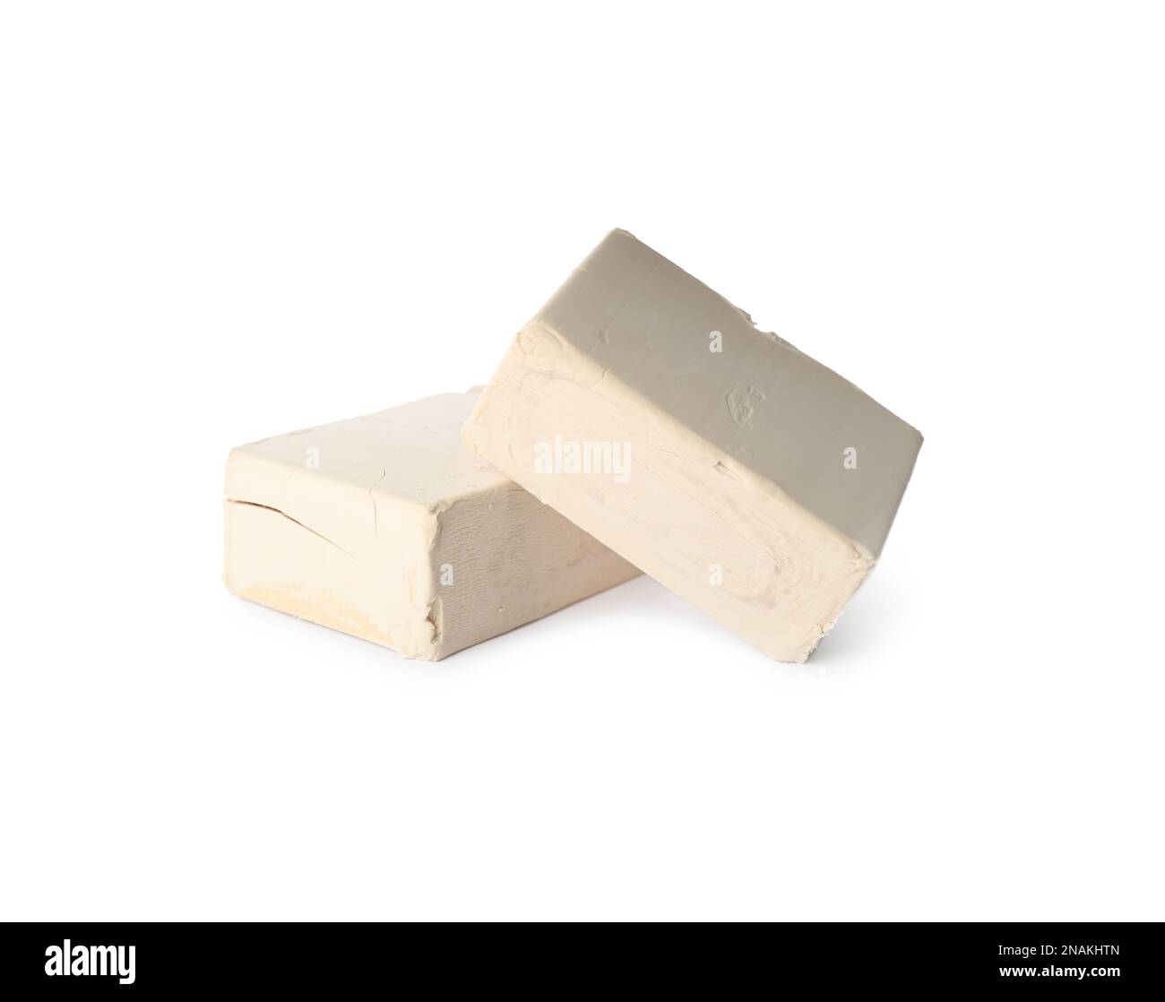 Blocks of compressed yeast on white background Stock Photo