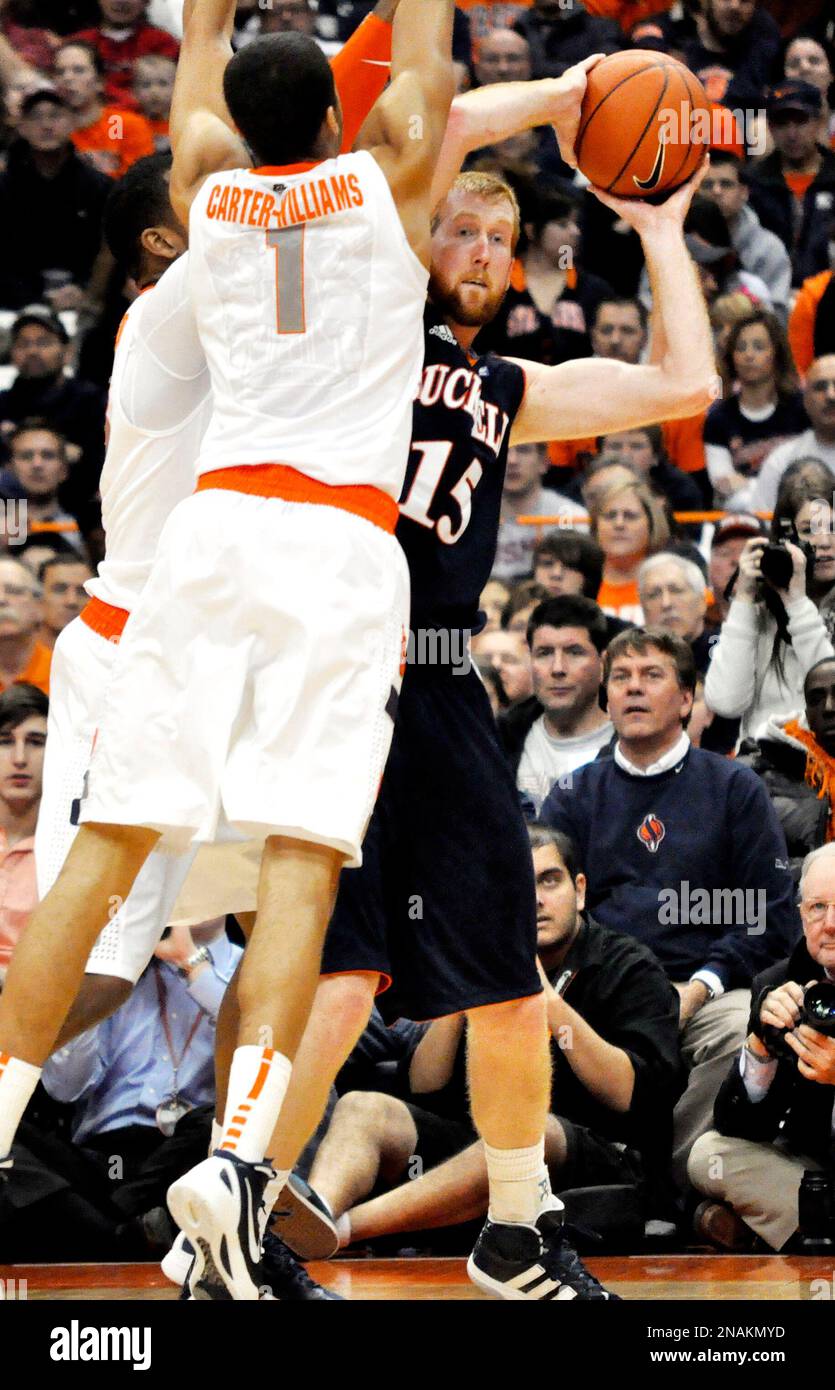 Bucknell's Joe Willman, right, is pressured by Syracuse's Michael