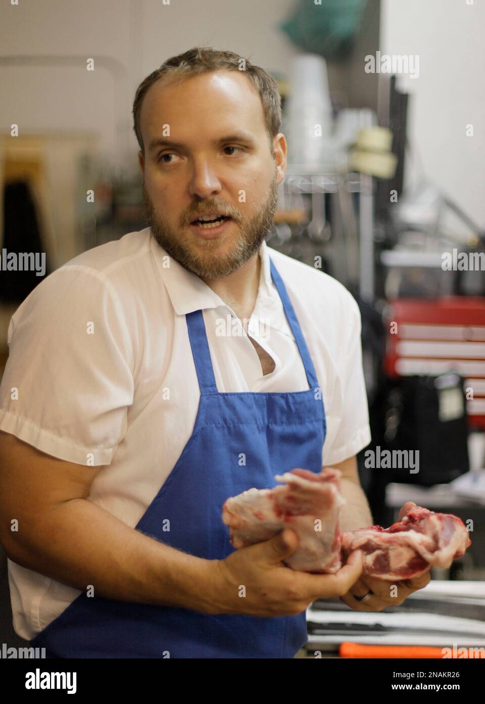 In this photo taken Wednesday, Dec. 14, 2011, Ryan Farr offers