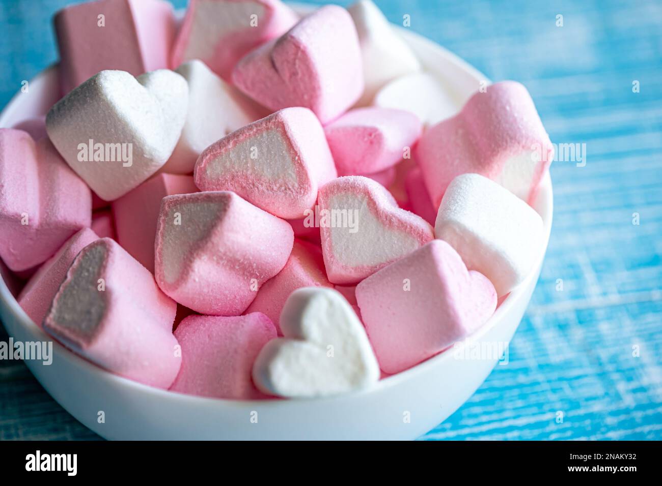 Pink heart shaped marshmallows in the white cup isolated on white back  ground Stock Photo - Alamy